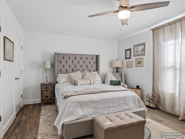 bedroom featuring ceiling fan and dark hardwood / wood-style flooring