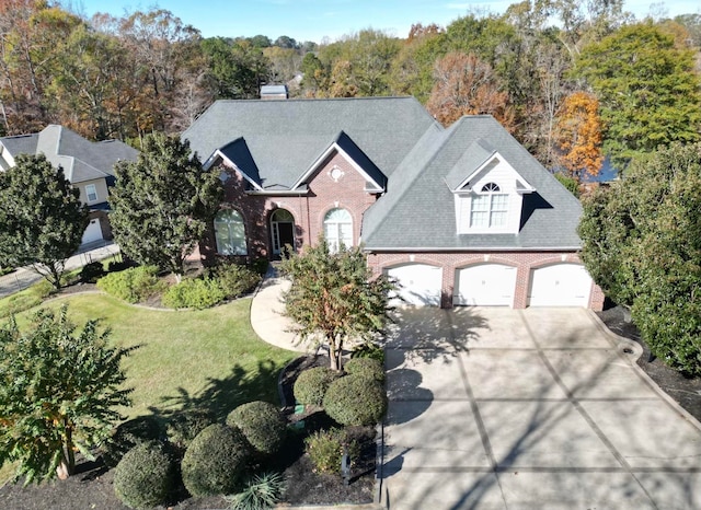 view of front of property featuring a garage and a front yard