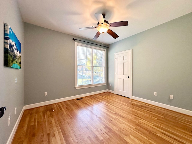 unfurnished bedroom featuring light hardwood / wood-style flooring and ceiling fan