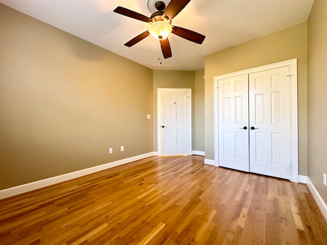 unfurnished bedroom with light hardwood / wood-style floors and ceiling fan