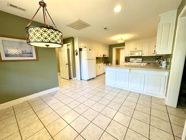 kitchen with white appliances, sink, a textured ceiling, decorative light fixtures, and white cabinetry