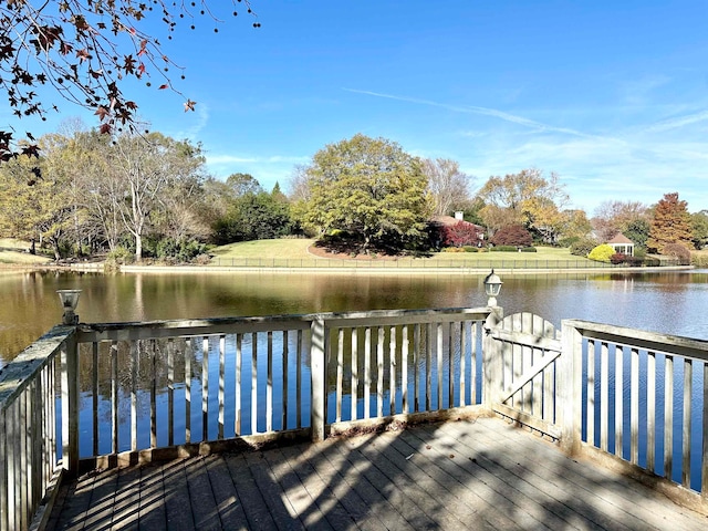 dock area with a deck with water view