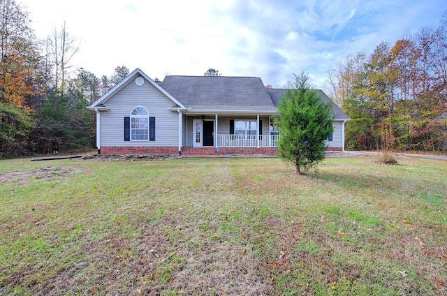 single story home with a front yard and covered porch