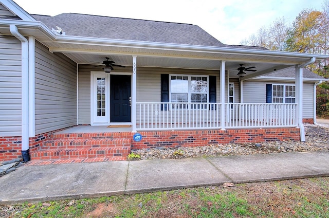 doorway to property with covered porch and ceiling fan