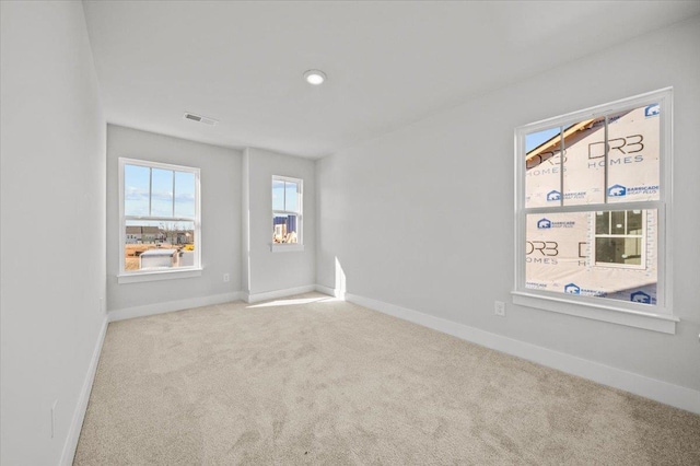 empty room featuring light colored carpet