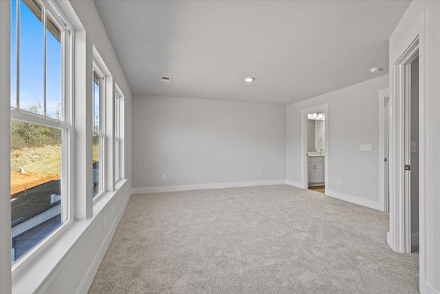 carpeted empty room with sink