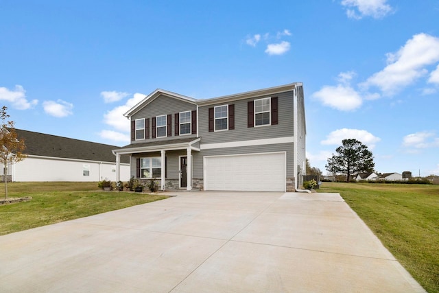 view of front of home featuring a front lawn and a garage