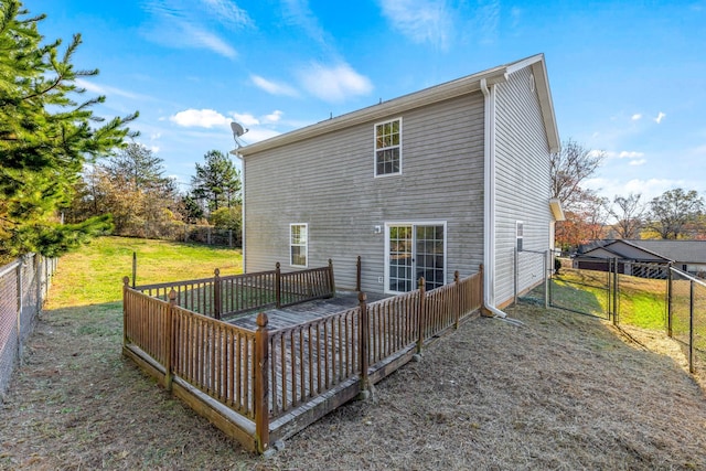 rear view of property featuring a yard