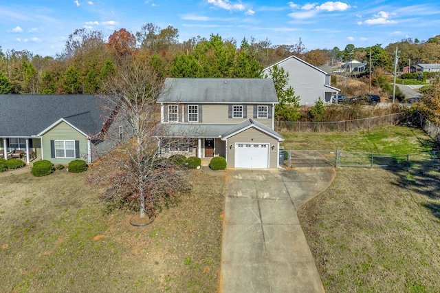 view of front of property with a front yard and a garage