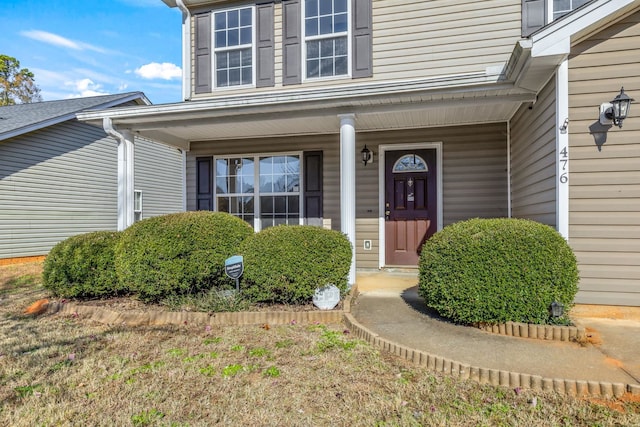 entrance to property featuring covered porch