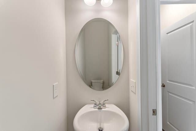 bathroom with sink and toilet