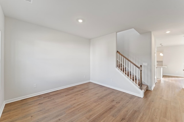 spare room featuring light hardwood / wood-style floors