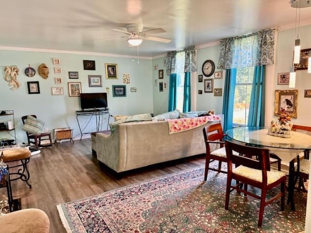 living room with hardwood / wood-style floors, ceiling fan, and crown molding