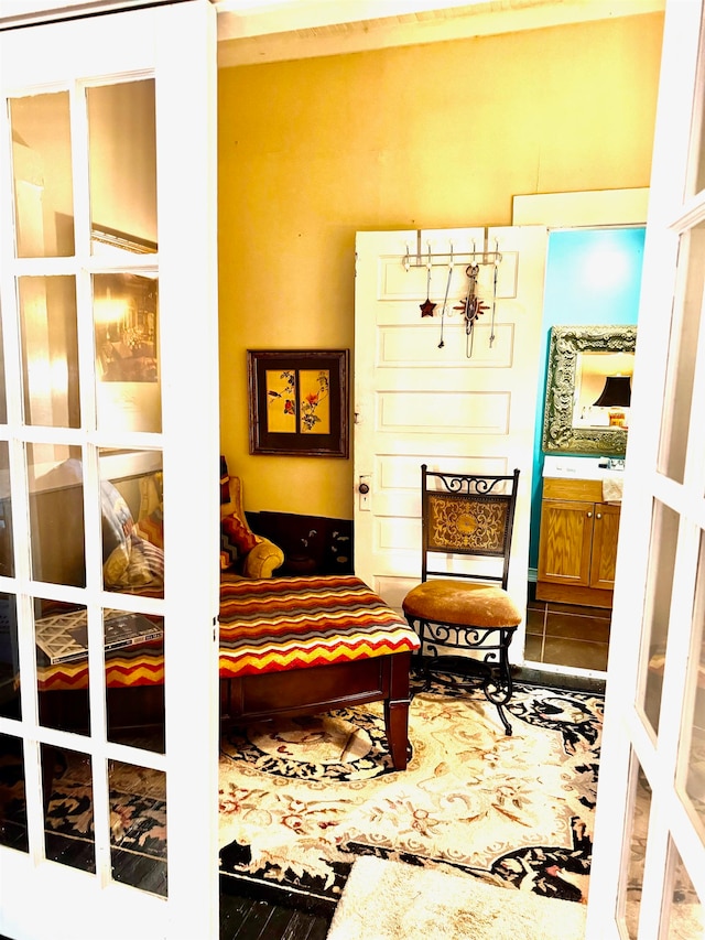 sitting room featuring tile patterned flooring