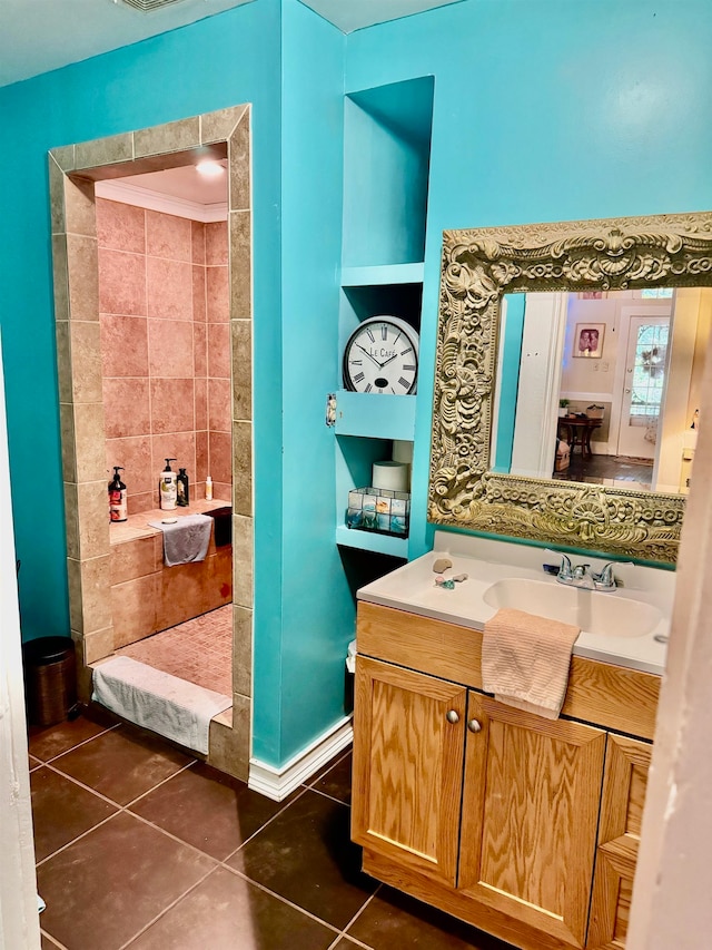 bathroom featuring tile patterned flooring and vanity