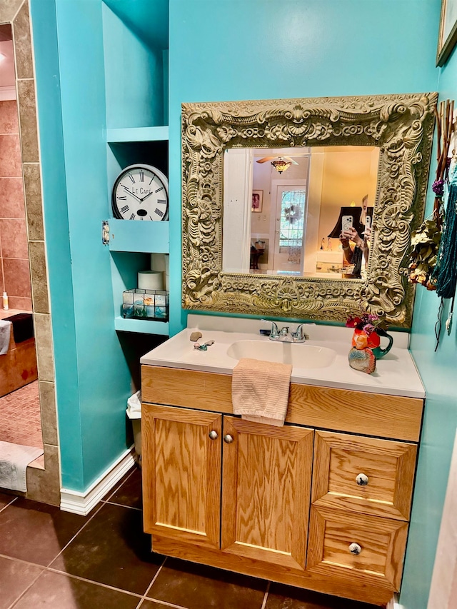 bathroom with tile patterned flooring, vanity, ceiling fan, and built in features