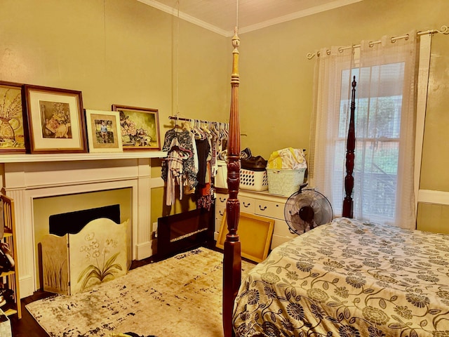 bedroom with dark hardwood / wood-style flooring and ornamental molding