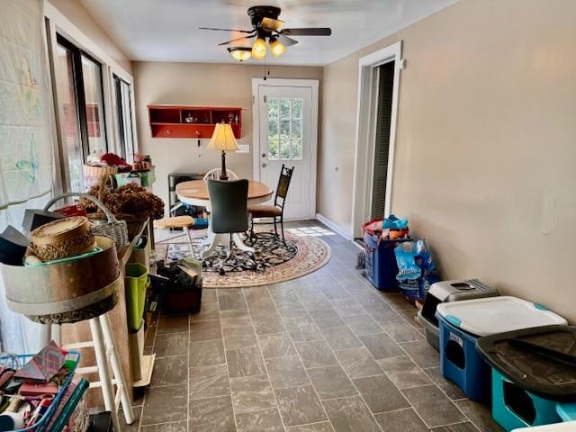 sunroom / solarium with ceiling fan