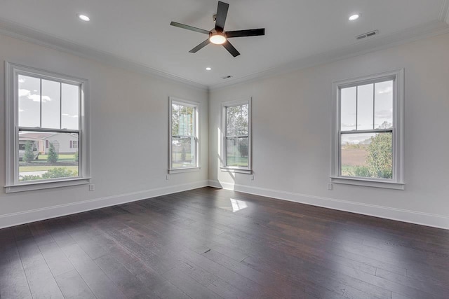 empty room featuring dark hardwood / wood-style floors and ornamental molding