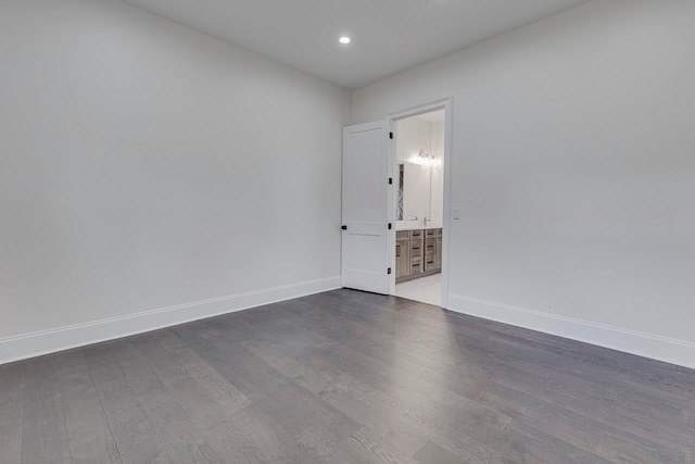 empty room featuring dark wood-type flooring