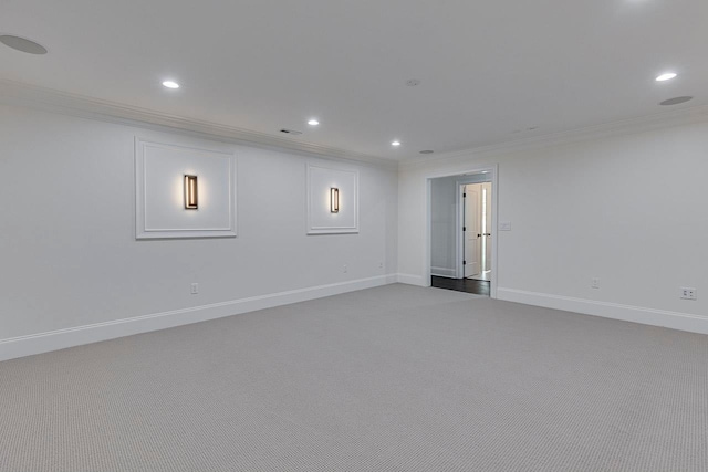 empty room with crown molding and carpet