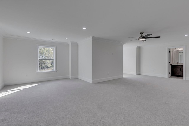 unfurnished living room with light carpet, ceiling fan, and ornamental molding