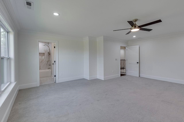 unfurnished room with ceiling fan, light colored carpet, and ornamental molding