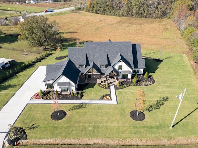 birds eye view of property with a rural view