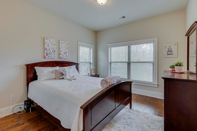 bedroom with wood-type flooring