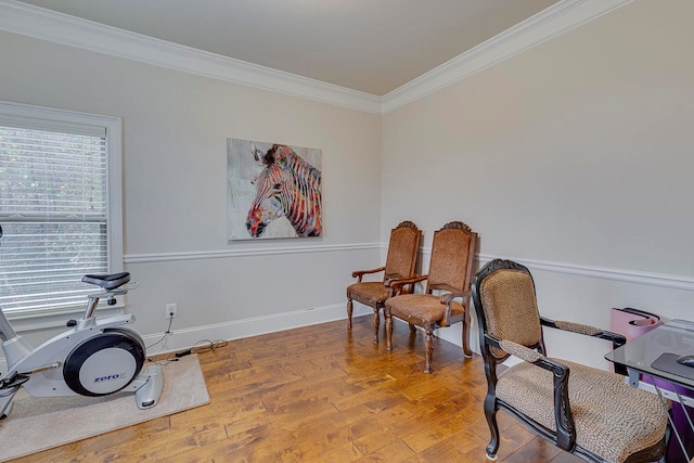 home office featuring hardwood / wood-style floors and ornamental molding