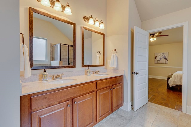 bathroom with ceiling fan, tile patterned floors, an enclosed shower, vaulted ceiling, and vanity