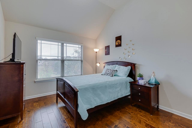 bedroom with dark hardwood / wood-style floors and vaulted ceiling