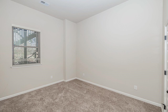 empty room with light colored carpet