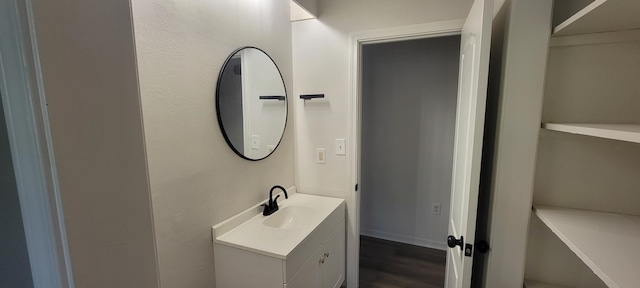 bathroom featuring hardwood / wood-style flooring and vanity