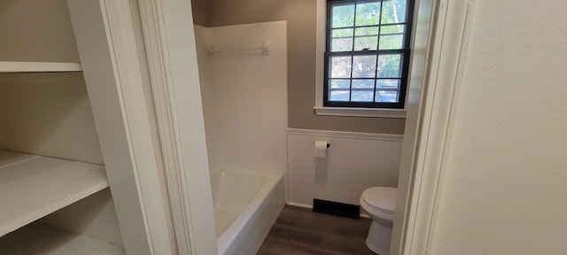 bathroom with toilet and wood-type flooring