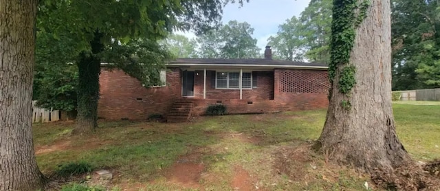 ranch-style home with a front lawn