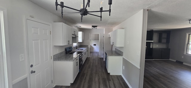 kitchen featuring white cabinets, electric range, dark hardwood / wood-style floors, and plenty of natural light