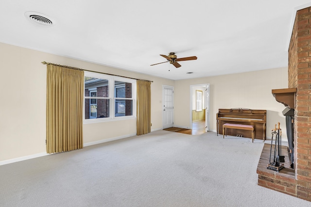 unfurnished living room with ceiling fan and carpet floors