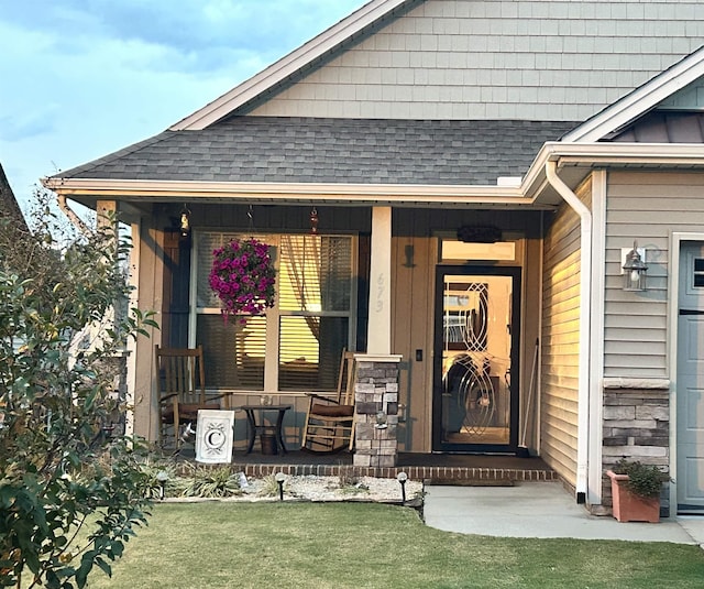 view of exterior entry featuring a porch