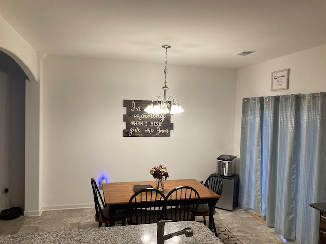 dining room featuring a chandelier