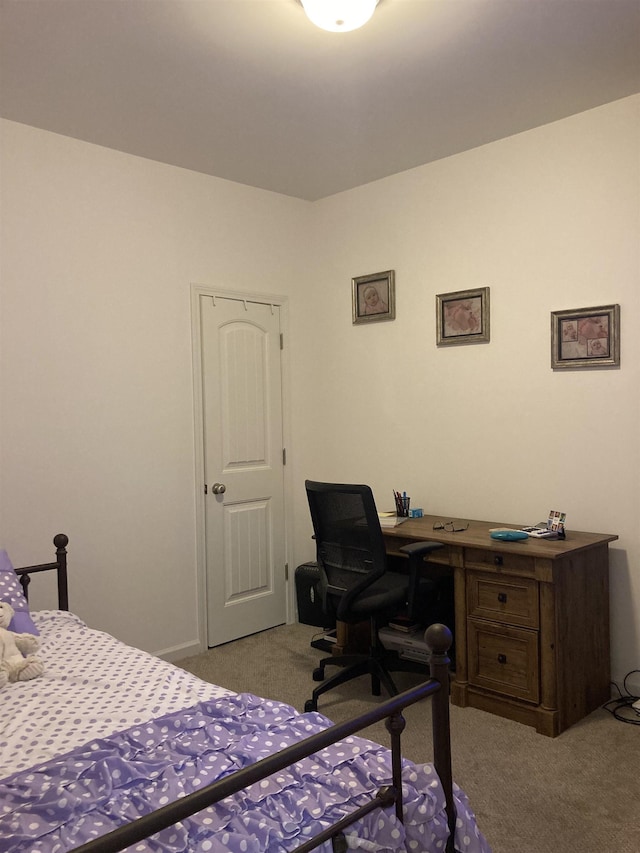 bedroom with light colored carpet