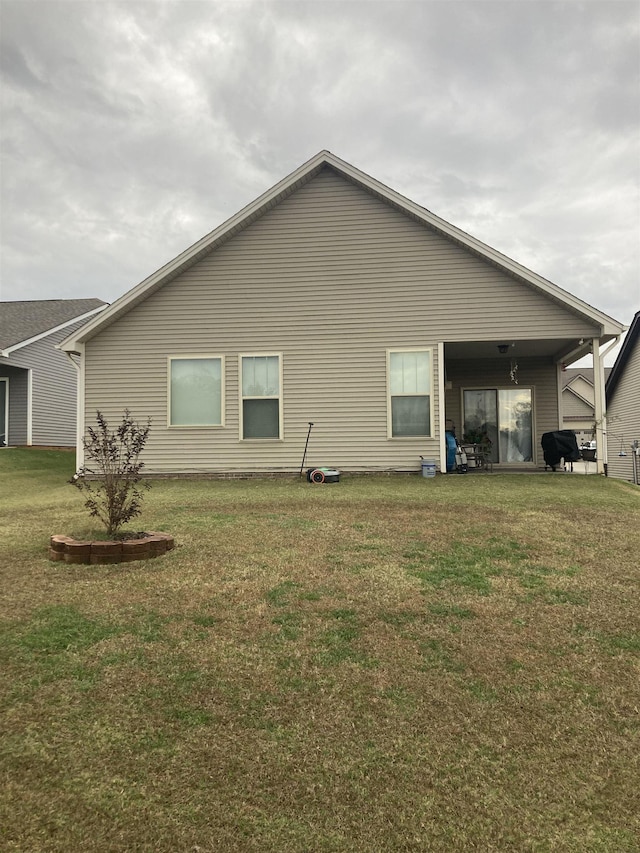 view of property exterior featuring a lawn