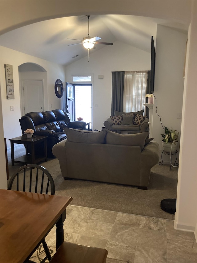 living room with ceiling fan and lofted ceiling