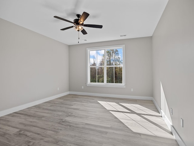 unfurnished room with ceiling fan and light hardwood / wood-style flooring