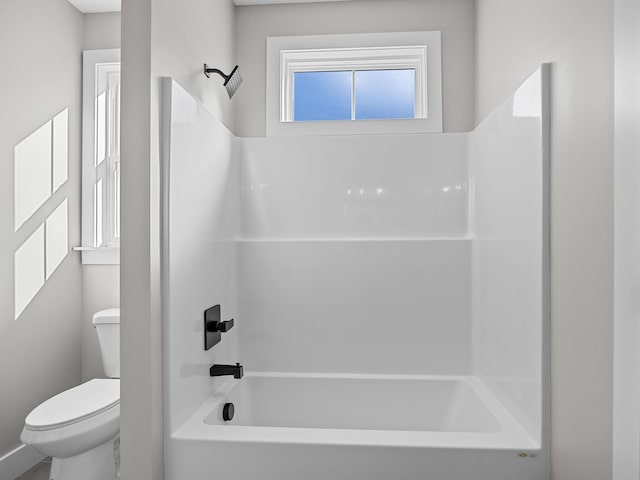 bathroom featuring toilet and shower / bathtub combination