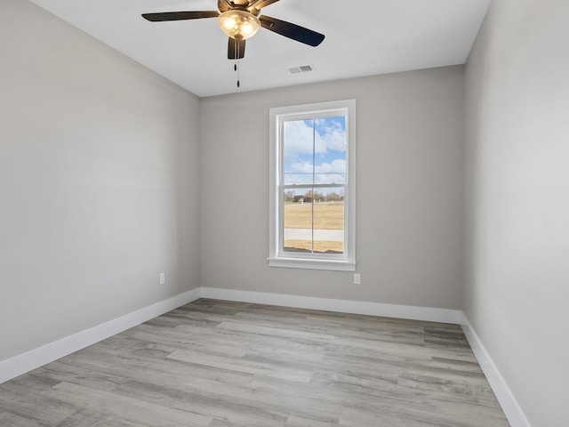 unfurnished room featuring ceiling fan and light wood-type flooring