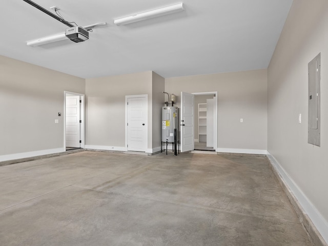 garage with a garage door opener, electric water heater, and electric panel