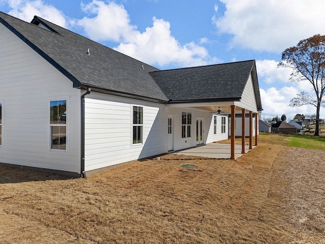 rear view of house with a patio area and ceiling fan