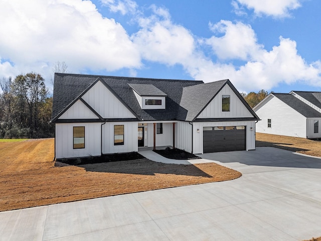 modern farmhouse featuring a garage