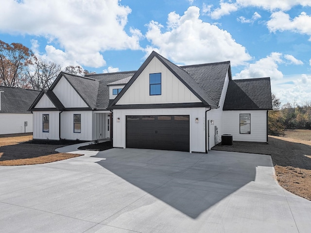 modern farmhouse featuring central AC unit and a garage